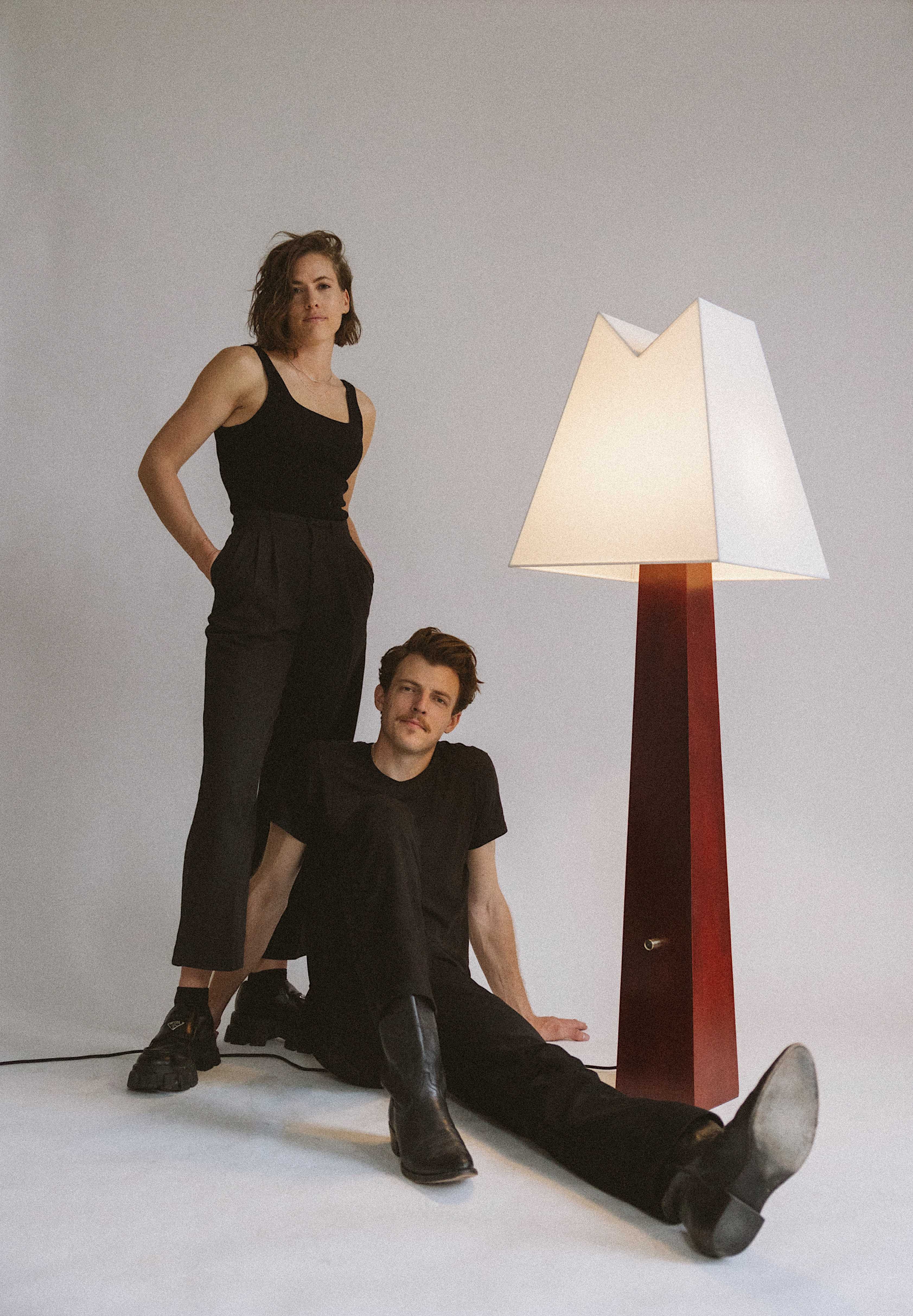 Jacob and Chelsie Starley, pose with floor lamp from Alpine collection
